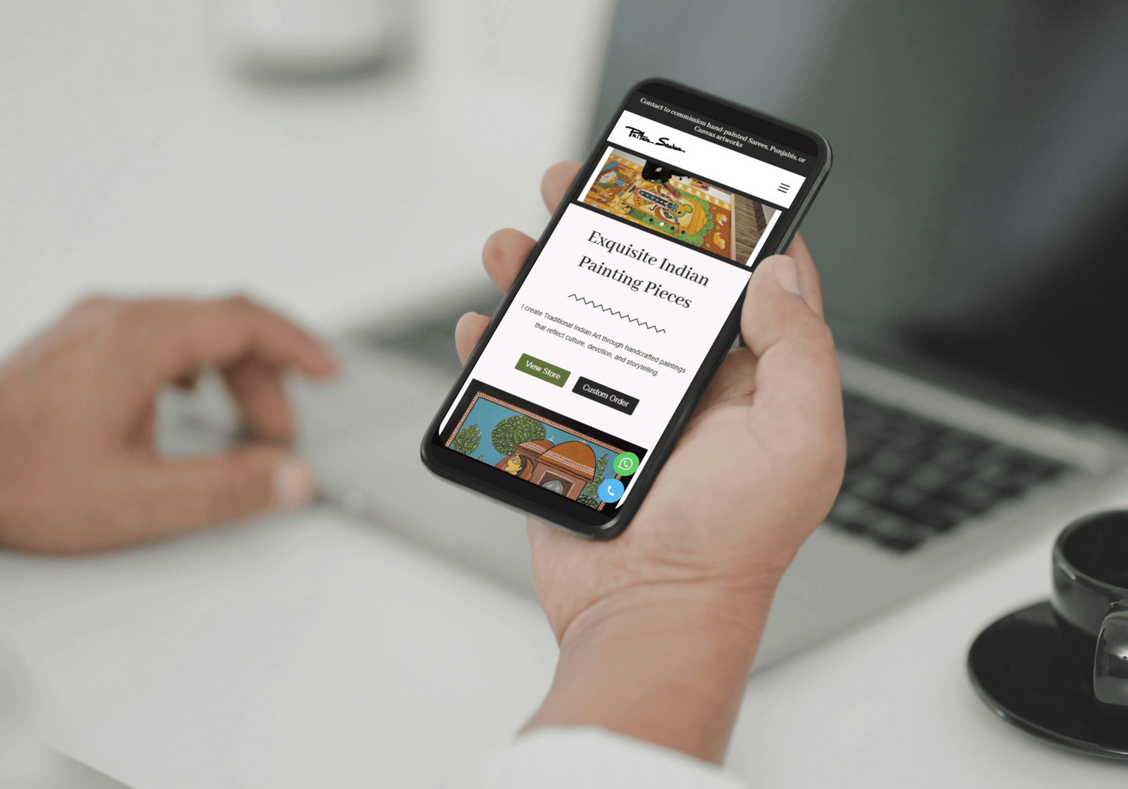 A mobile in hand showing website design